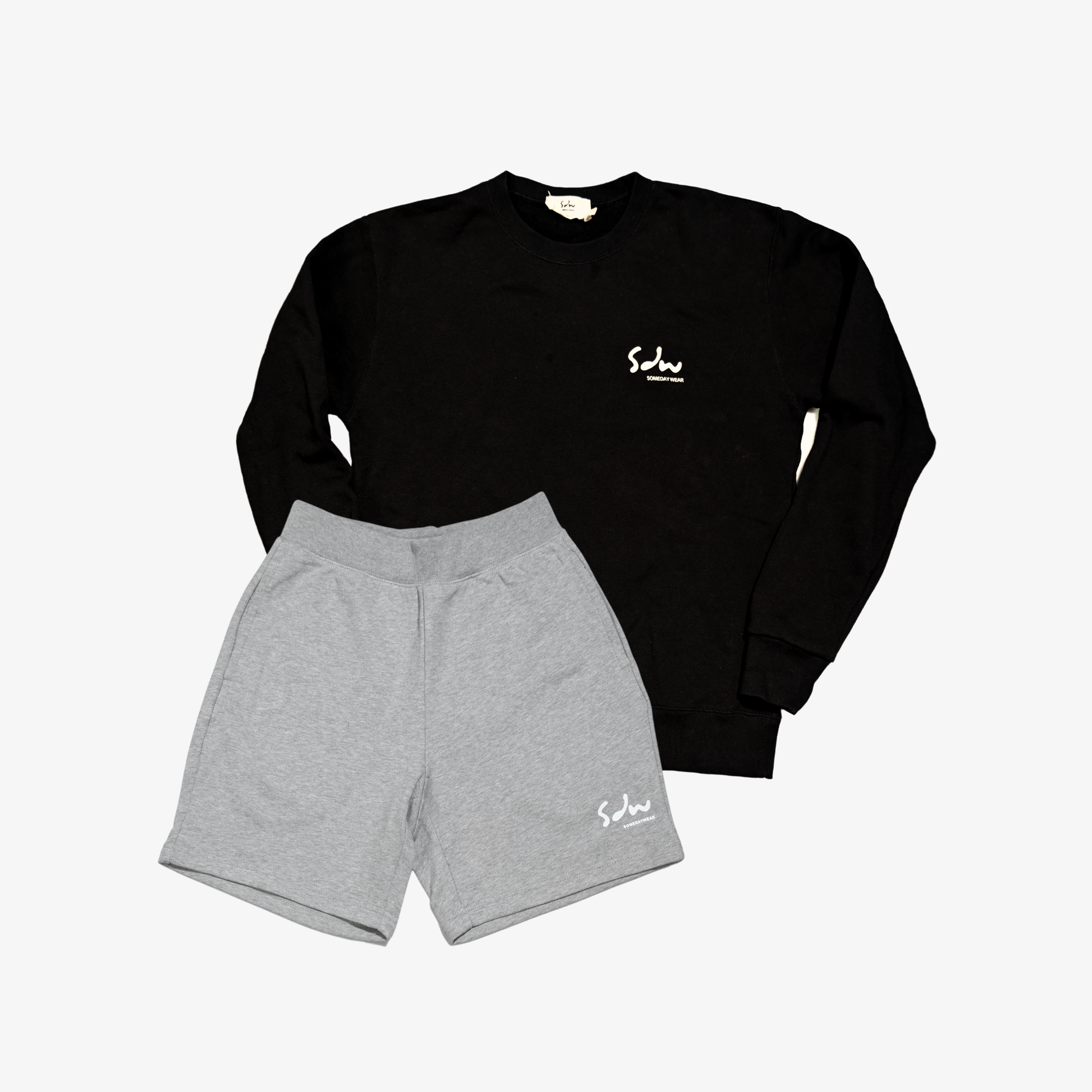 Black sweatshirt to pair with an everyday shorts in grey that stay comfortable through the day.

Made from midweight cotton blend, they feel soft and breathable while holding their shape. 