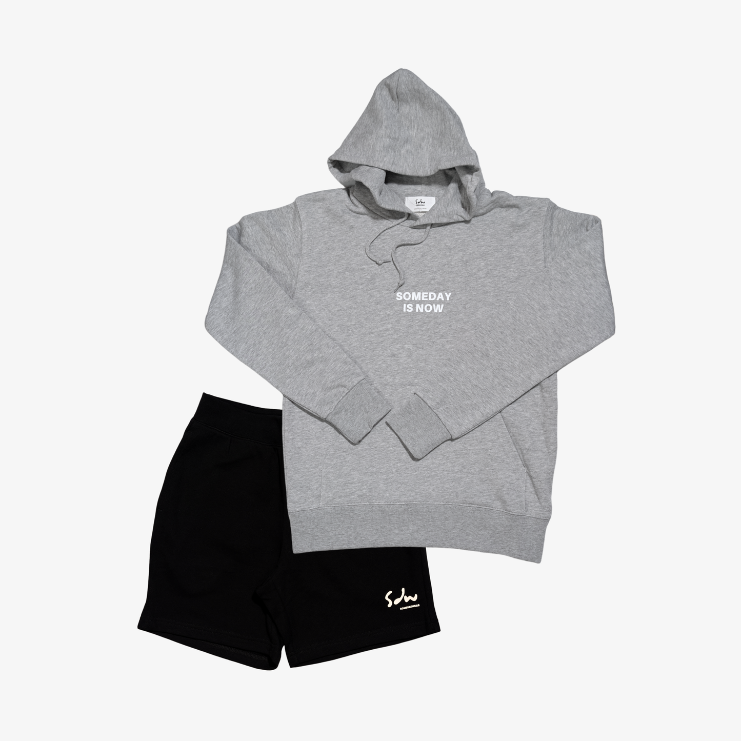 Gray hoodie & shorts set made from midweight cotton. They are soft, breathable, and easy to wear across different settings. Comfortable enough for long days, without feeling too light or flimsy.